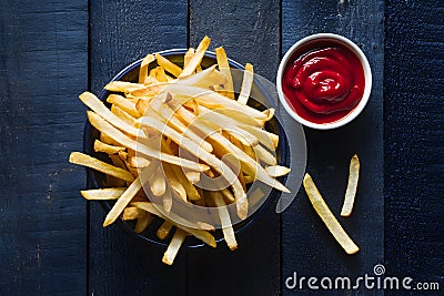 Tempting fries paired perfectly with a basket of ketchup Stock Photo