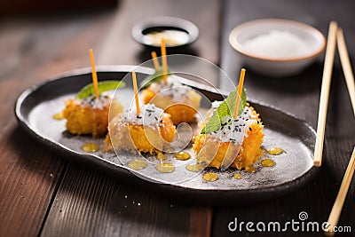 tempura cheesecake bites with powdered sugar Stock Photo