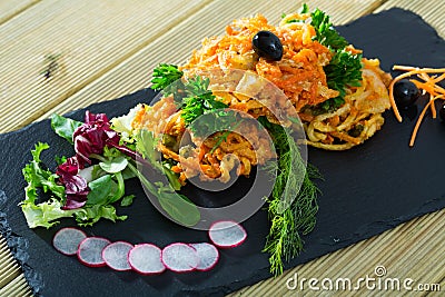 Tempura vegetables with greens, radish, black olives Stock Photo