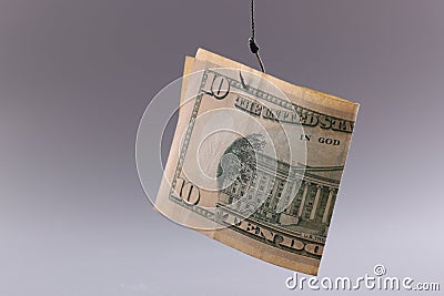 Ten dollar bill on gray background. Arnings with minimal investment Stock Photo