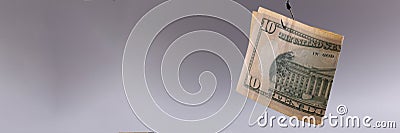 Ten dollar bill on gray background. Arnings with minimal investment Stock Photo