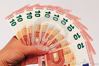 Ten euro banknotes in hand Stock Photo