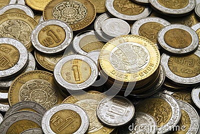 Ten Mexican Pesos Coin on a Pile of Mexican Coins Stock Photo
