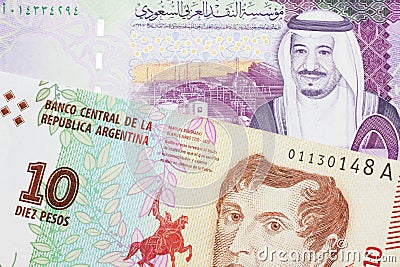 A peso note from Argentina, close up with a Saudi riyal bill Stock Photo