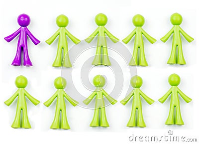 Ten pieces of generic, human shaped plastic pieces in green and purple Stock Photo