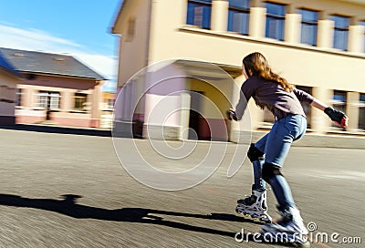 Tenage girl rollering. Quick moving. Stock Photo