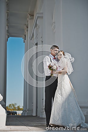 The tender embrace of the newlyweds from the Church 3907. Stock Photo