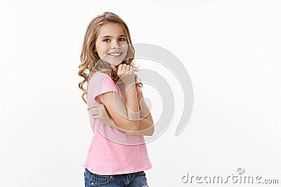Tender lovely carefree young girl student kid, smiling silly laughing, posing delighted and cheering, turn camera Stock Photo
