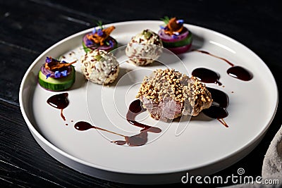 Tender meat with puffed rice. Dish of authors cuisine. Turkey meat recipe from a restaurant Stock Photo