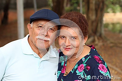 Tender older ethnic couple candid Stock Photo
