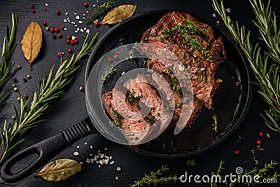 Tender sliced sous-vide beef steak from in a cast iron pan Stock Photo