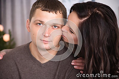 Tender wife kissing husband Stock Photo