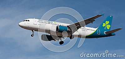 Tenerife, Spain January 13 st, 2024. Airbus A320-214 Aer Lingus Airlines flies in the blue sky Editorial Stock Photo
