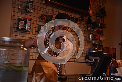 TENGGARONG, INDONESIA - MEI 2017 : Handsome barista cafe coffee preparing cup and making of coffee Service Concept for customer in Editorial Stock Photo