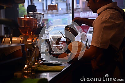 TENGGARONG, INDONESIA - MEI 2017 : Handsome barista cafe coffee Editorial Stock Photo