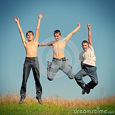 Tennage Boys jumping Stock Photo