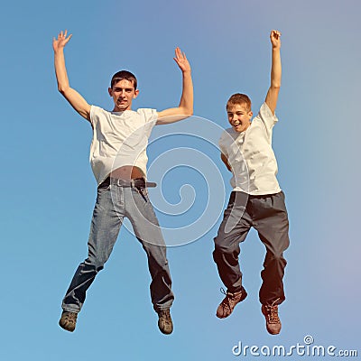 Tennage Boys jumping Stock Photo