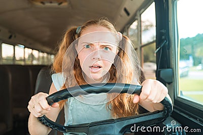 Tennager drive schoolbus. Teen driver on School Bus. Stock Photo