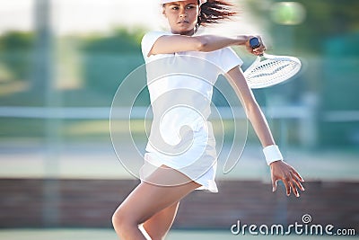 Tennis action, outdoor match and woman fast hit a sports ball with a racket on a exercise court. Sport game, workout Stock Photo