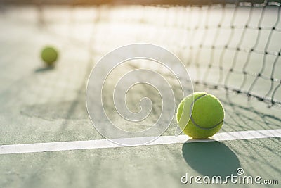 Tennis ball on blur net Stock Photo