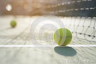 Tennis ball on blur net Stock Photo