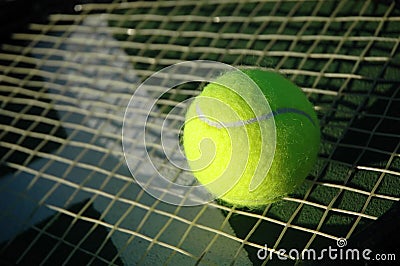 Tennis Ball on Racket Stock Photo