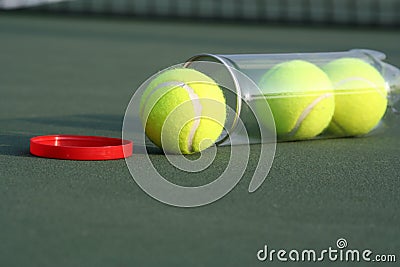 Tennis balls on tennis court Stock Photo
