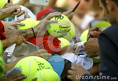 Tennis fans hold a ball Editorial Stock Photo