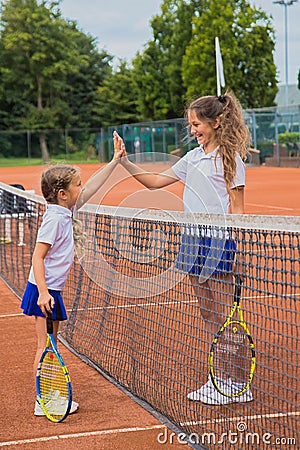 Tennis kids. Children give five each other Stock Photo