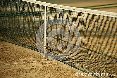 Tennis net and sand tennis court Stock Photo
