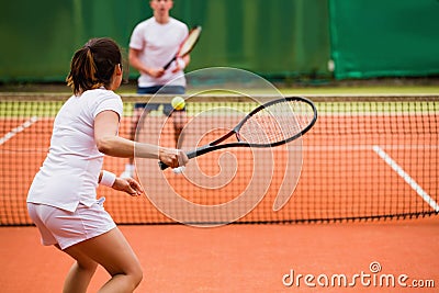 Tennis players playing a match on the court Stock Photo