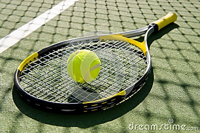 Tennis Racket and Ball on Court Stock Photo