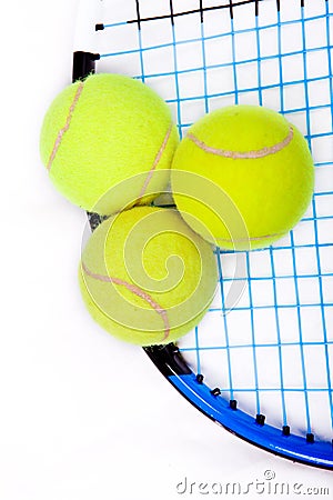 Tennis raquet with a tennis balls Stock Photo