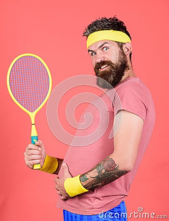 Tennis sport. Tennis club concept. Man bearded hipster wear old school sport outfit with bandages. Athlete hold tennis Stock Photo