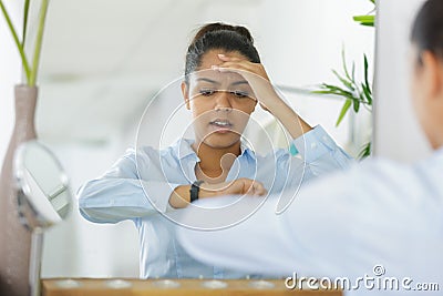 tensed woman late for work Stock Photo