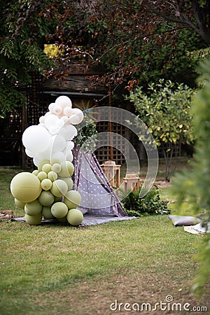Tent for the child outside, decorated with balloons. Stock Photo