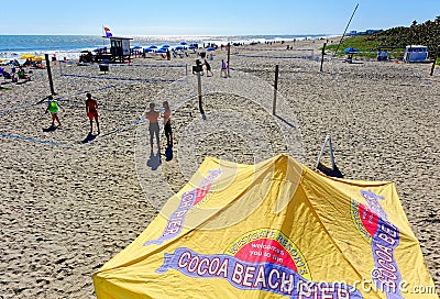 Tent and Volleyball Game on Cocoa Beach Editorial Stock Photo