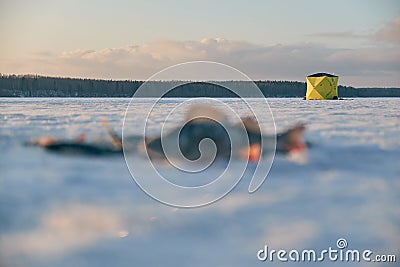 Winter fishing tent stands on the sea Stock Photo