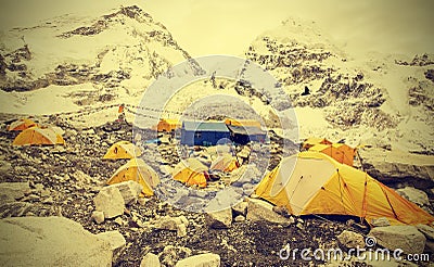 Tents in Everest Base Camp in cloudy day, vintage effect. Stock Photo
