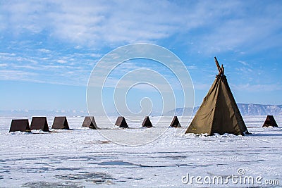 Tents on frozen lake at Lake Bikal, Russia Stock Photo