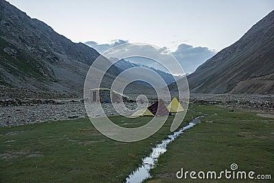 Tents pitched on a beautiful campsite on a meadow Editorial Stock Photo