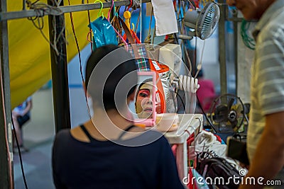 Teochew Opera. Artiste putting on makeup. Traditional heritage arts Editorial Stock Photo