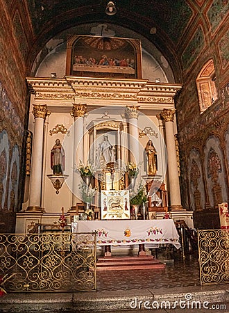 Altarpiece at the interior of Preciosa Sangre de Cristo church. Teotitlan del Valle, Oaxaca, Mexico Editorial Stock Photo