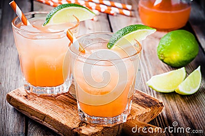 Tequila sunrise cocktail with ice and lime Stock Photo