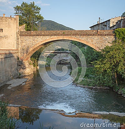 The Ter river and old bridge in Ripoll town Stock Photo