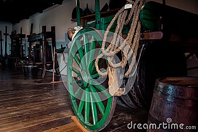 Terceira, Azores PORTUGAL - 1 August 2020 - Vintage room with wooden wagon wheel and kites at the Biscoitos Wine Museum Editorial Stock Photo