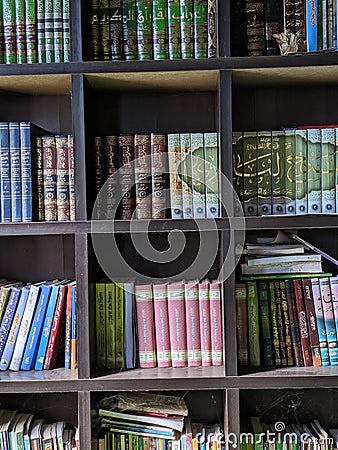 Terengganu, Malaysia - 30 May 2023 : Book's of Al- Qur'an and hadith in the cabinet Editorial Stock Photo