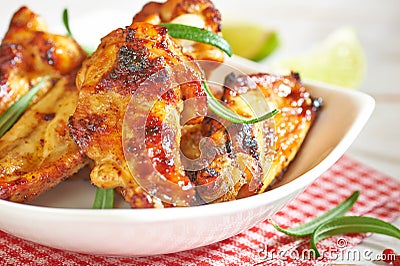 Teriyaki chicken wings. Baked chicken with fresh rosemary. Homemade food. Symbolic image. Stock Photo