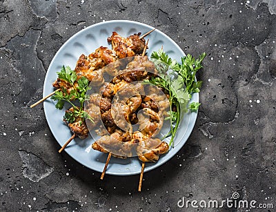Teriyaki marinated duck skewers on a dark background, top view. Delicious snack, tapas, appetizers Stock Photo