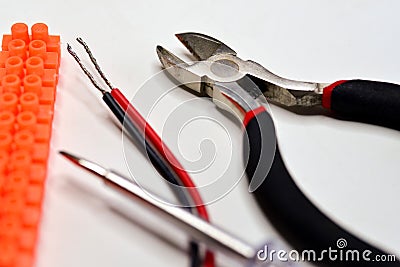 Terminal block with cable, pliers and screwdriver Stock Photo